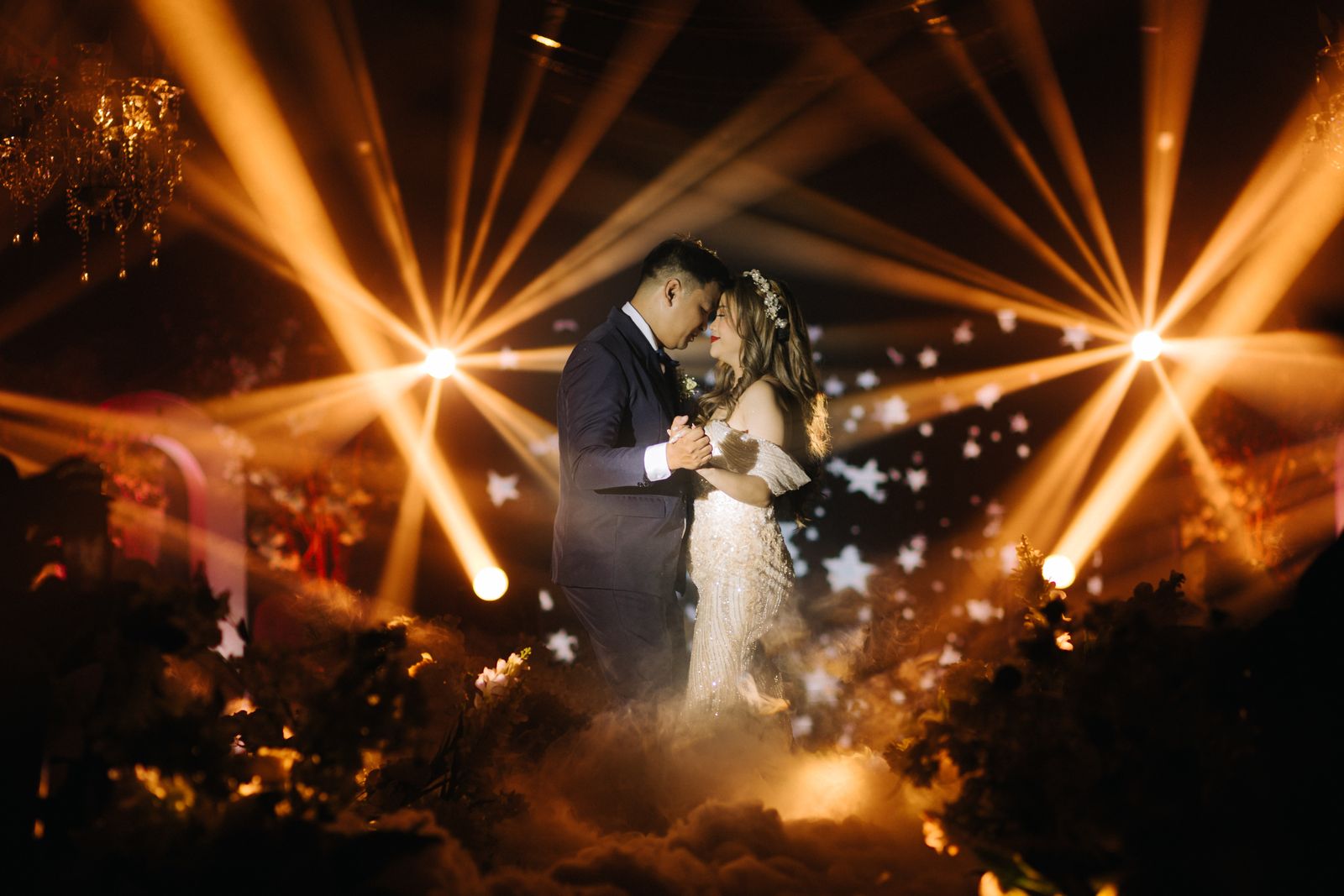 A first dance beneath festoon lights
